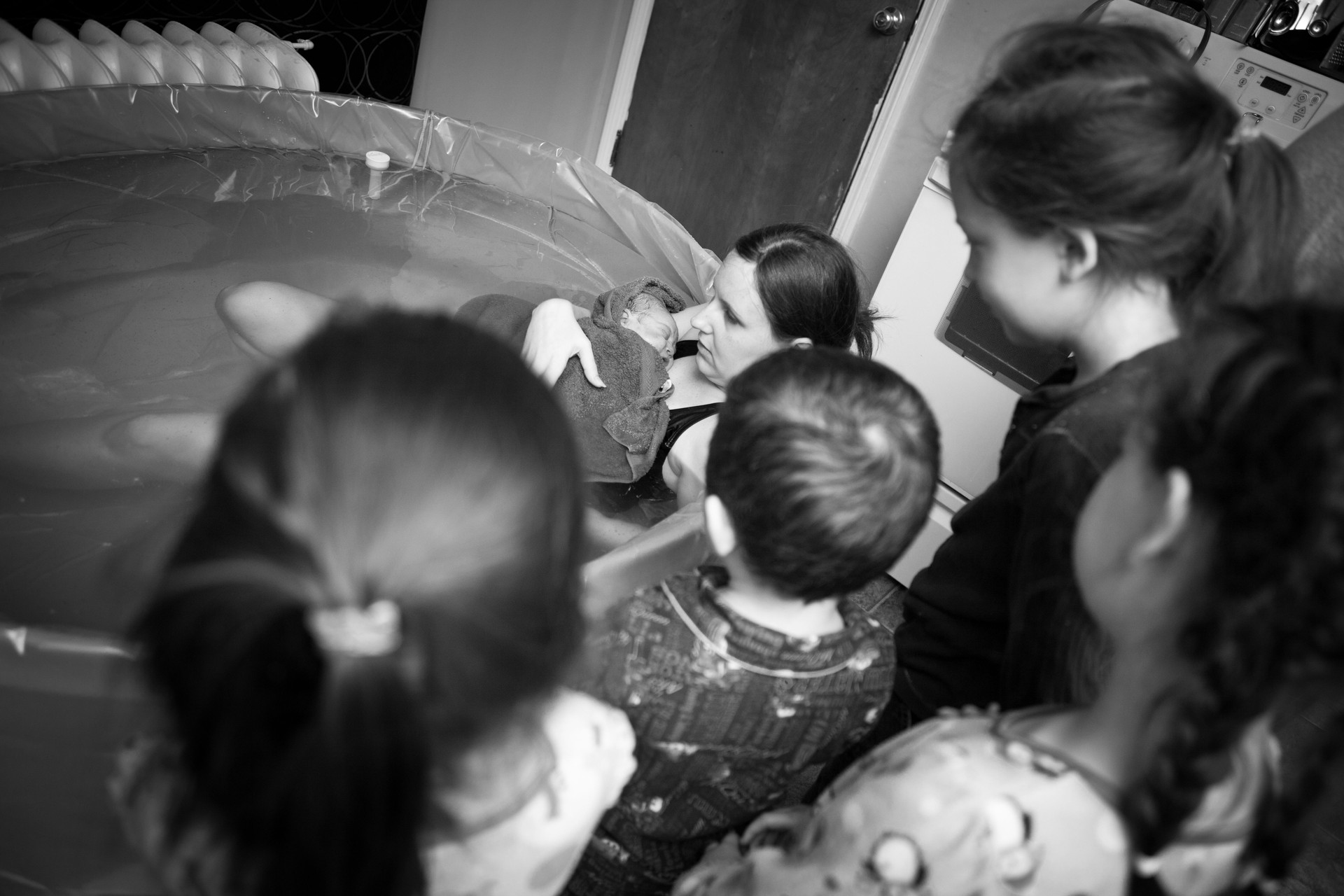 Siblings Meeting Newborn Brother After Home Water Birth